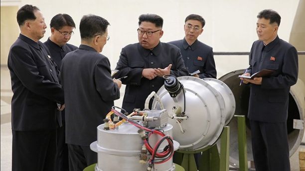 North Korean leader Kim Jong Un provides guidance with Ri Hong Sop (3rd L) and Hong Sung Mu (L) on a nuclear weapons program in this undated photo released by North Korea's Korean Central News Agency (KCNA) in Pyongyang September 3, 2017. KCNA via REUTERS ATTENTION EDITORS - THIS PICTURE WAS PROVIDED BY A THIRD PARTY. REUTERS IS UNABLE TO INDEPENDENTLY VERIFY THE AUTHENTICITY, CONTENT, LOCATION OR DATE OF THIS IMAGE. NOT FOR SALE FOR MARKETING OR ADVERTISING CAMPAIGNS. NO THIRD PARTY SALES. NOT FOR USE BY REUTERS THIRD PARTY DISTRIBUTORS. SOUTH KOREA OUT. NO COMMERCIAL OR EDITORIAL SALES IN SOUTH KOREA. THIS PICTURE IS DISTRIBUTED EXACTLY AS RECEIVED BY REUTERS, AS A SERVICE TO CLIENTS. TPX IMAGES OF THE DAY - RC11A4474900